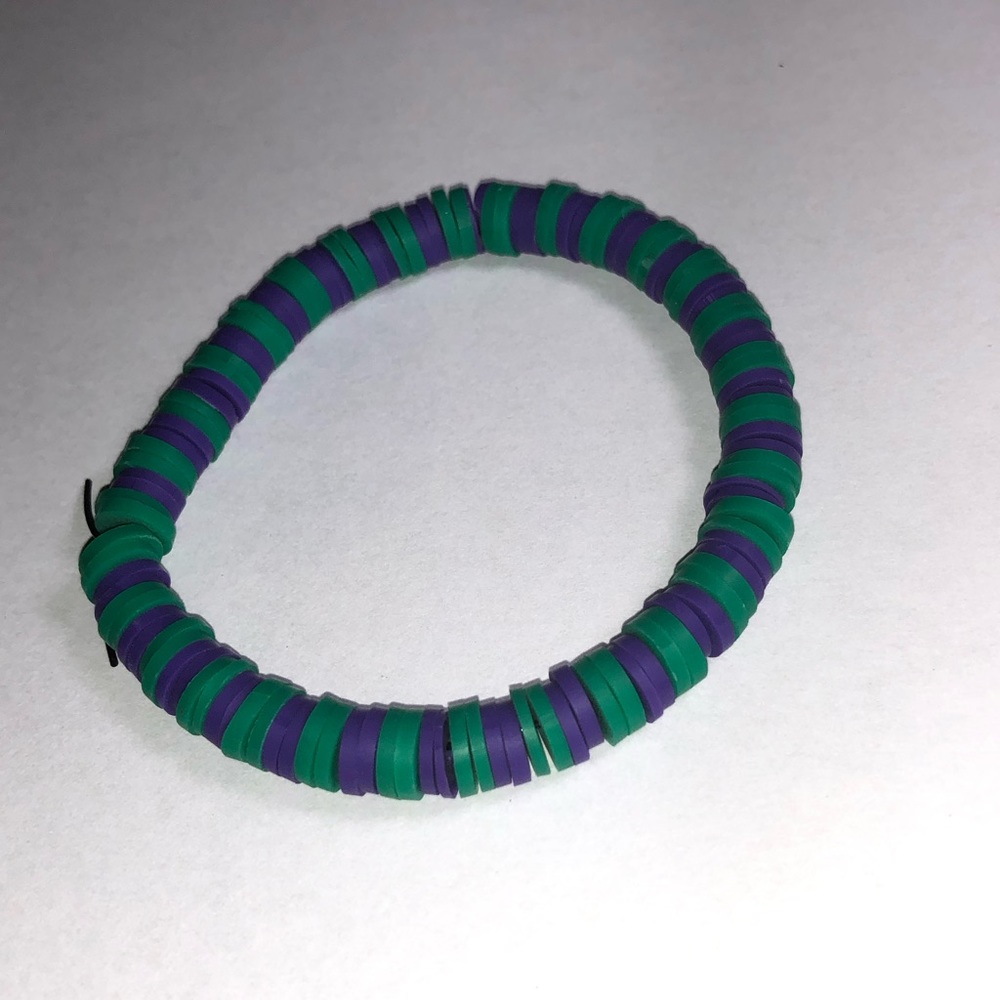 Clay bead bracelet, 7 inches the color is green and purple